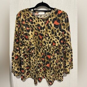 Baby doll animal print top with drama sleeves